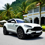 Aston Martin DBX - Sporty Lifestyle**

"Aston Martin DBX parked in front of a luxury resort in Langkawi, Malaysia. Fully clothed driver smiling, holding a surfboard. Tropical background, palm trees. High quality, professional automotive photography, perfect anatomy, appropriate attire, safe for work, family-friendly."

**